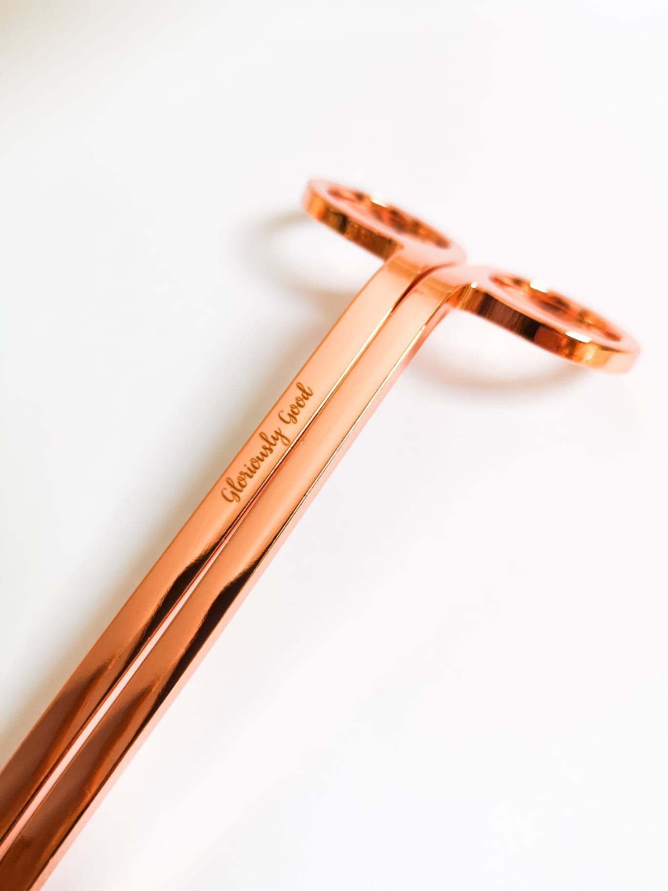 Rose gold wick trimmer made of coated stainless steel with Gloriously Good logo, standard size