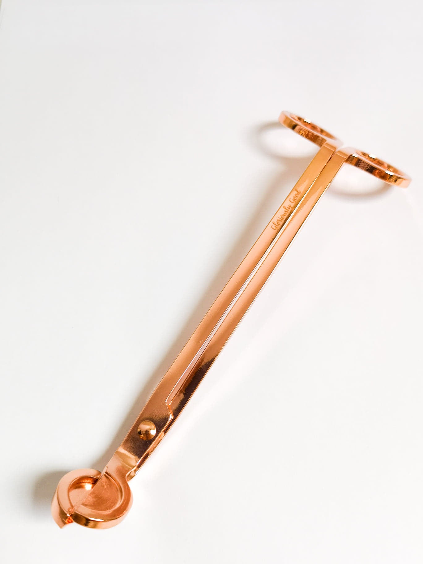 Rose gold wick trimmer made of coated stainless steel with Gloriously Good logo, standard size
